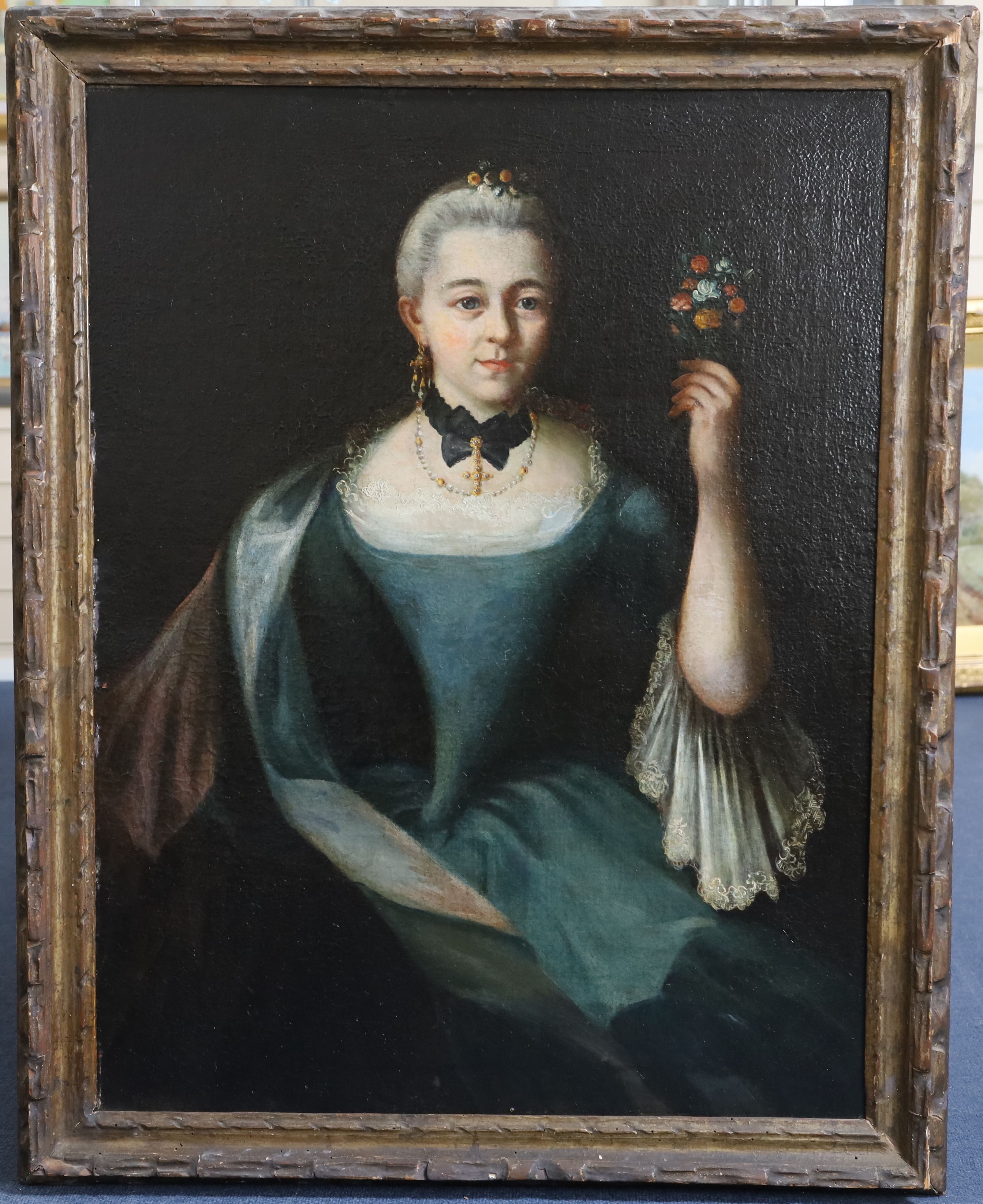 18th century French School Portrait of a lady holding a bouquet of flowers 32.5 x 25.25in.